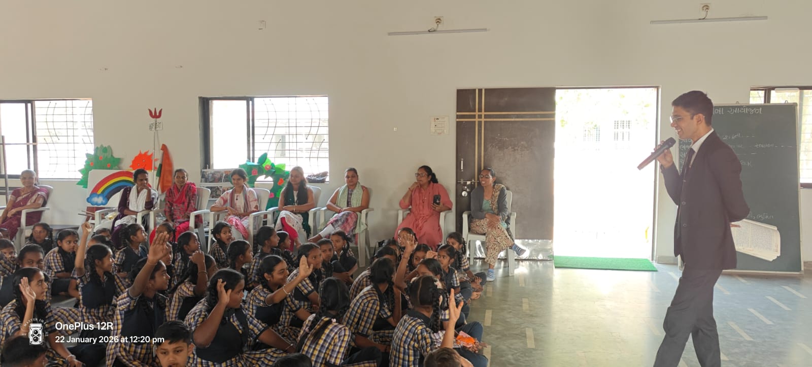 Dr. Naik addressing students at a school assembly