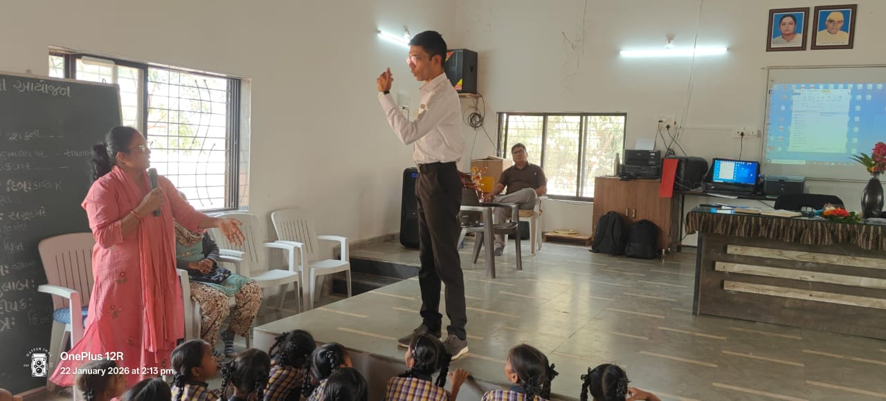 Dr. Naik presenting at a school event